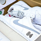 SB Dnk Low x Supreme 94 White Metallic Silver
