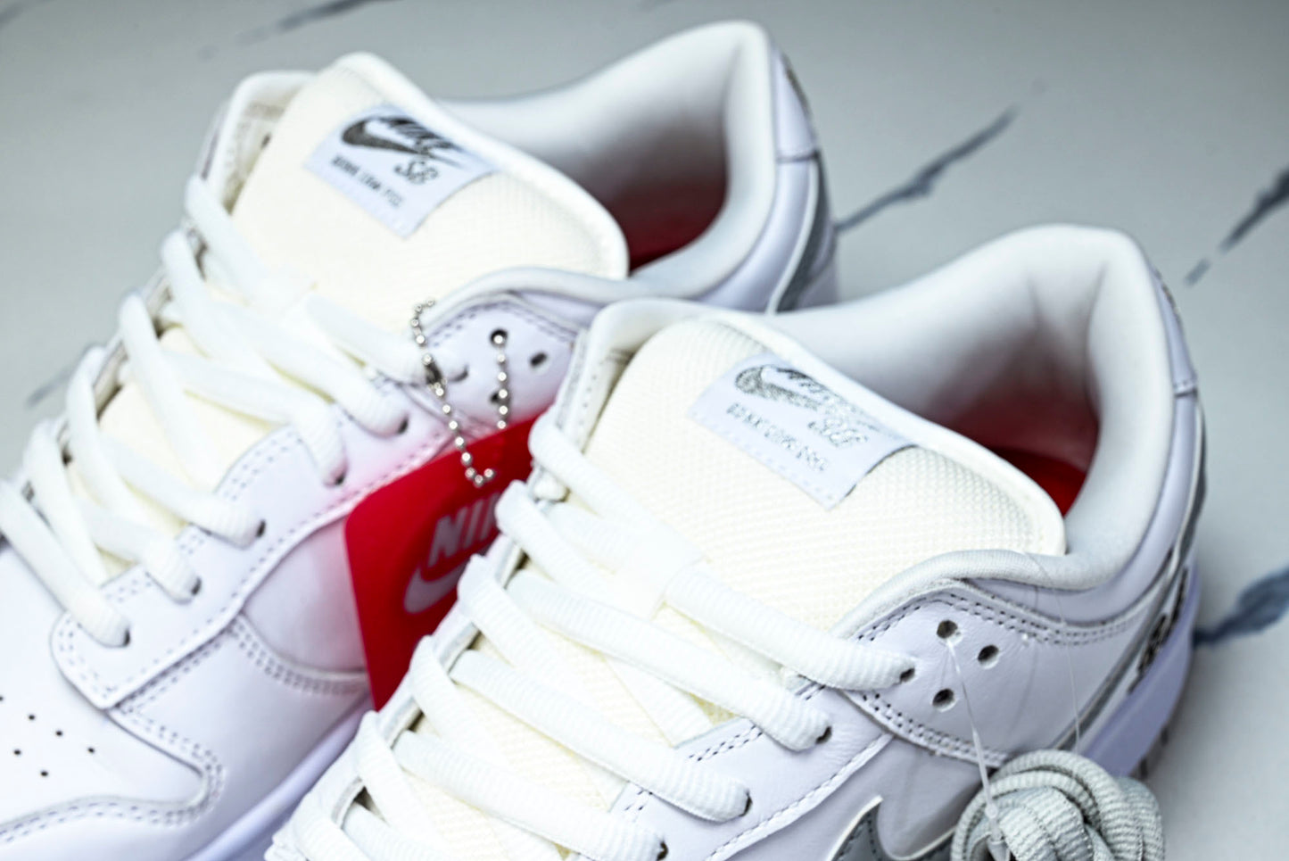 SB Dnk Low x Supreme 94 White Metallic Silver