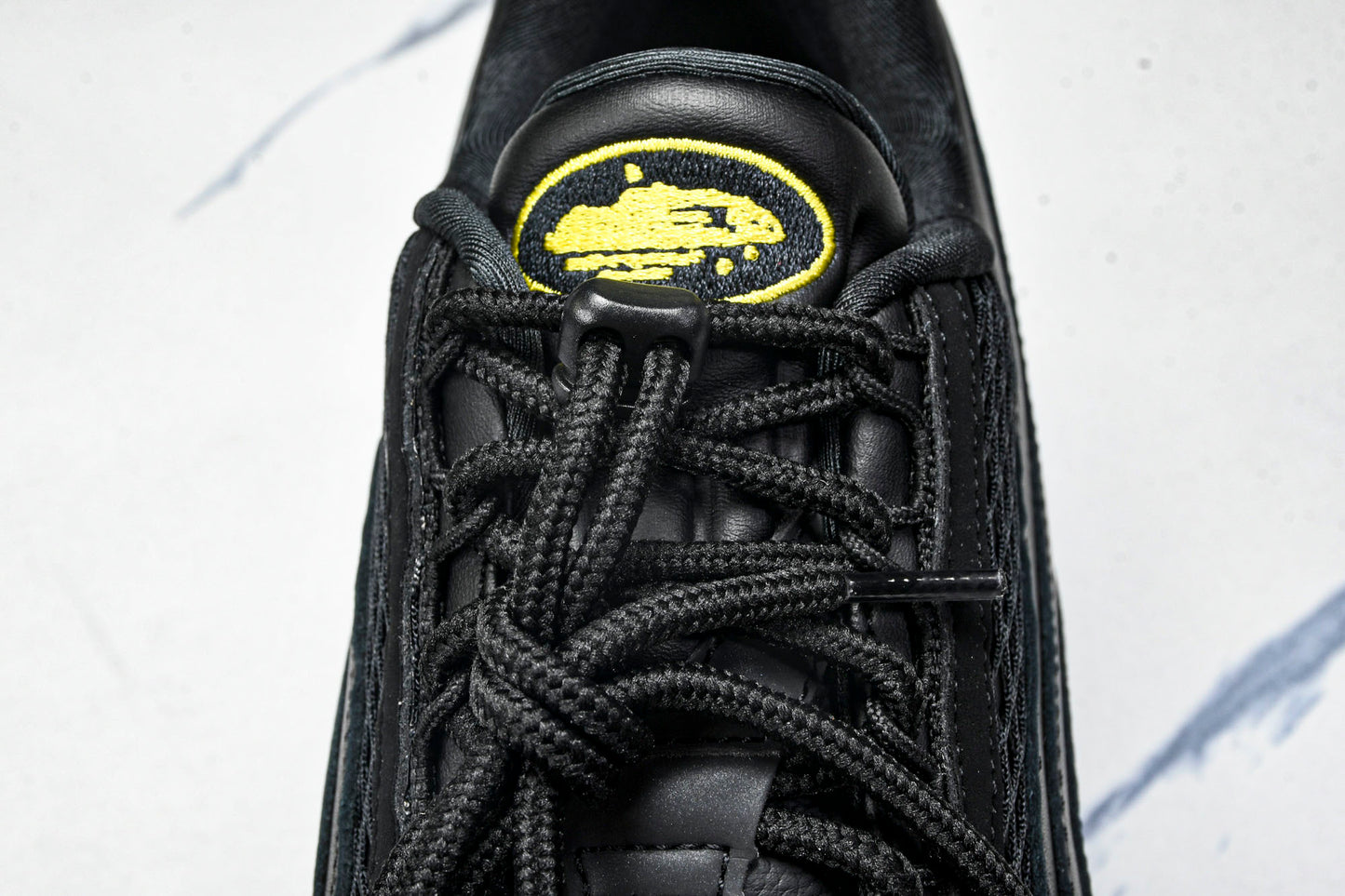 Corteiz x AM95 'Honey Black'